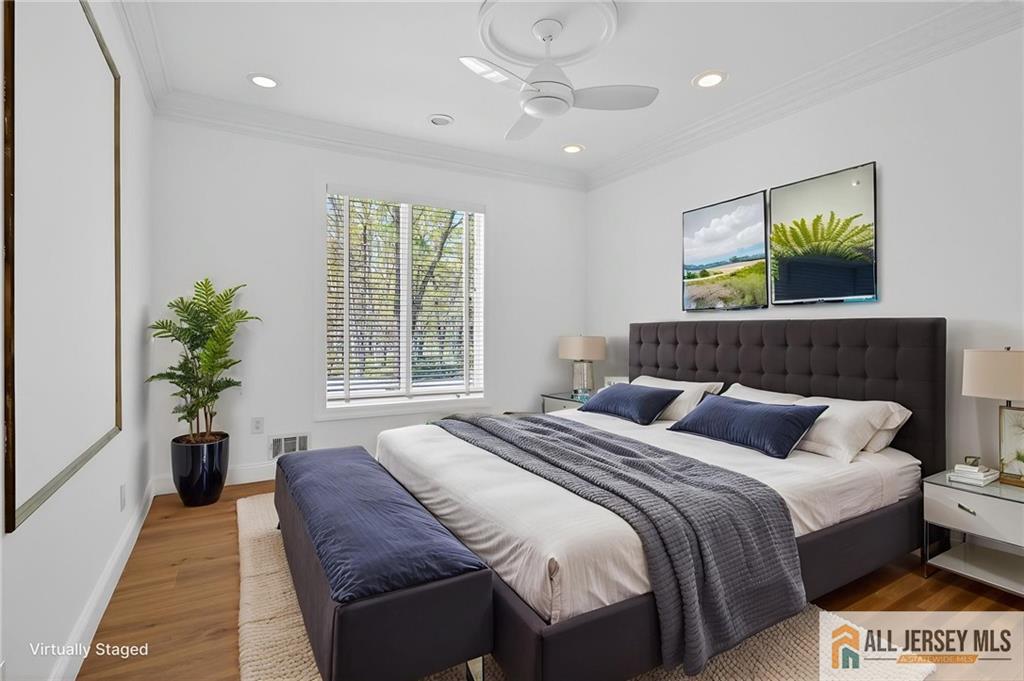 381 Monmouth Road Freehold, NJ 07728 - Photo 63 of 63 a bedroom with a bed and a potted plant
