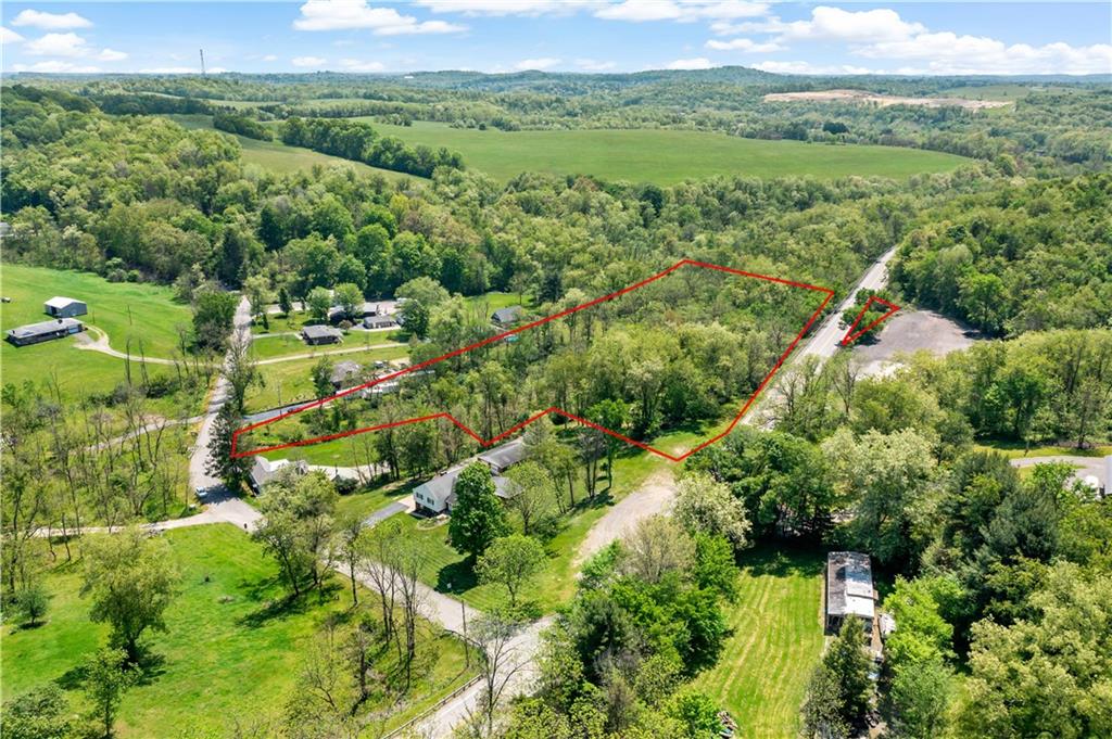 20 Coleman Road McDonald, PA 15057 - Photo 10 of 39 an aerial view of green landscape with trees houses and mountain view