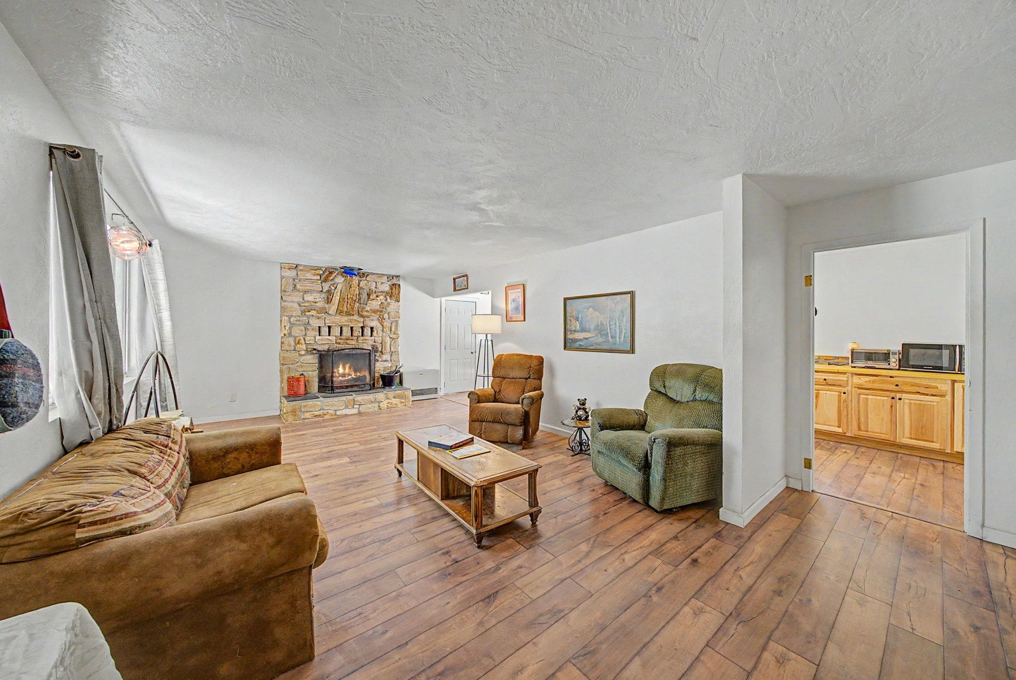 58374 Gill Ranch Road Cromberg, CA 96103 - Photo 3 of 44 a living room with furniture and a wooden floor