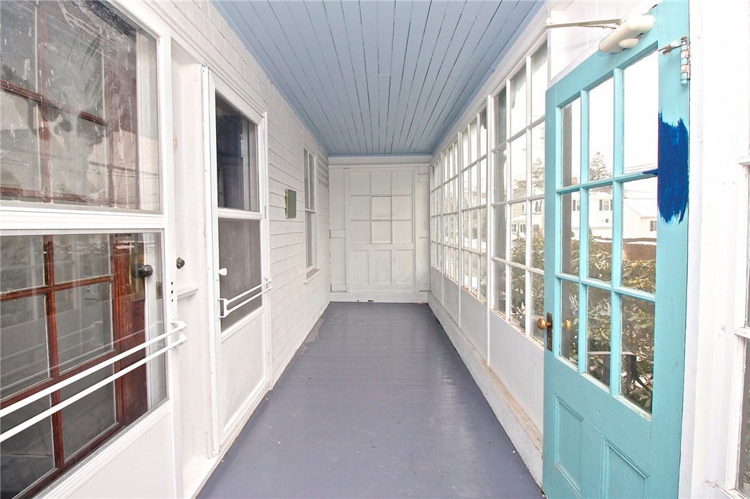 Front Porch seating area & door to unit 2
