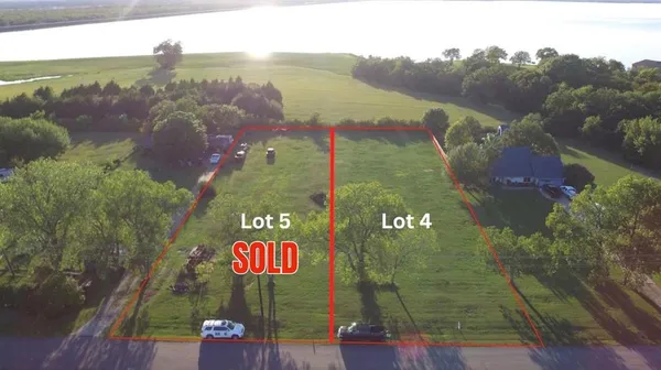 a view of a street with an ocean view