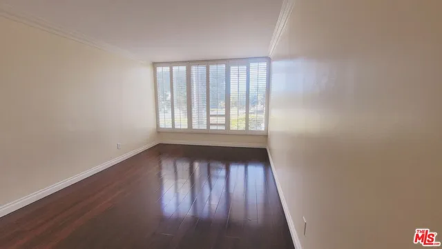 a bathroom with a tub a sink and mirror