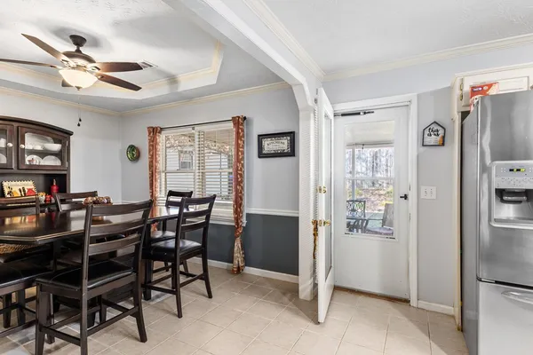 a view of a dining room with furniture window and outside view