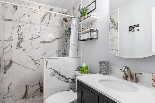 a utility room with sink dryer and washer