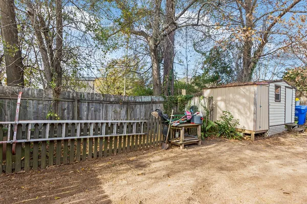 a view of a house with a yard and plants