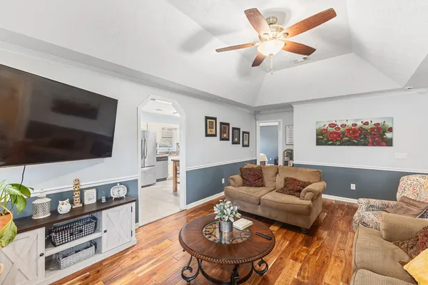 a living room with furniture and a fireplace