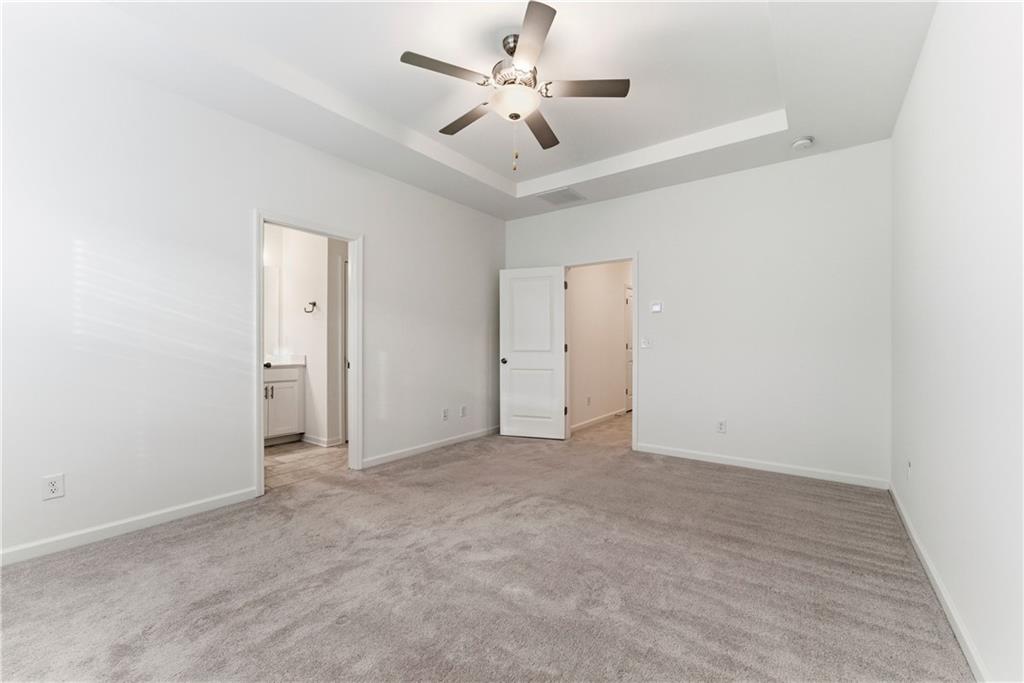 1621 Avery Way Tucker, GA 30084 - Photo 24 of 29 an empty room with fan and a ceiling fan