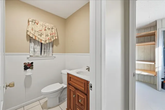 a white toilet sitting next to a bathroom sink