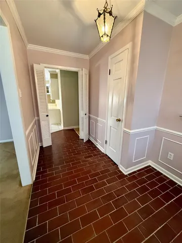 a view of a hallway view with wooden floor and staircase