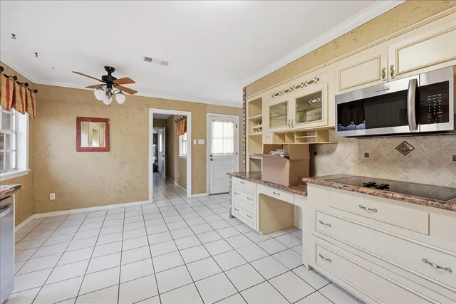 a kitchen with stainless steel appliances granite countertop a stove and a sink