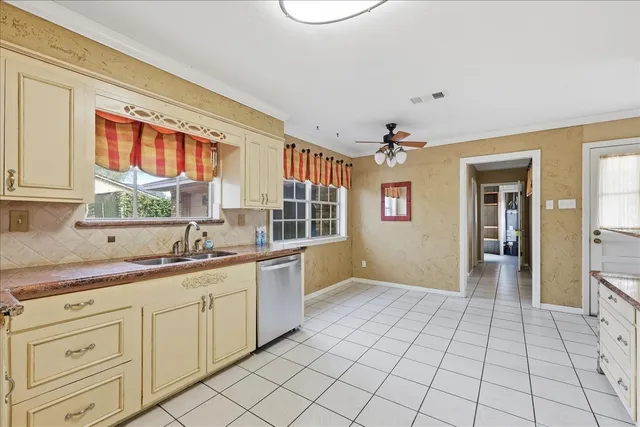 a open kitchen with a sink and cabinets