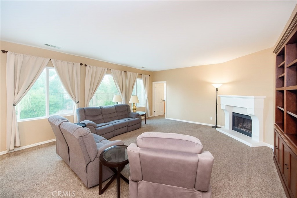 17094 Noble View Circle Riverside, CA 92503 - Photo 13 of 29 a living room with furniture and a fireplace