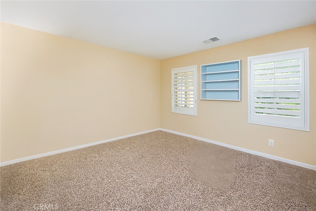 17094 Noble View Circle Riverside, CA 92503 - Photo 18 of 29 an empty room with windows