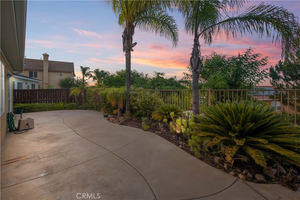 17094 Noble View Circle Riverside, CA 92503 - Photo 27 of 29 a view of a lake with a palm tree next to a yard