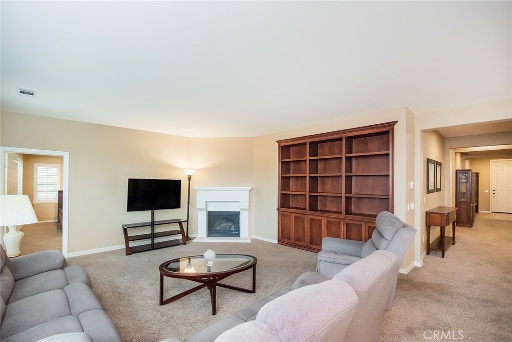 17094 Noble View Circle Riverside, CA 92503 - Photo 4 of 29 a living room with furniture and a flat screen tv