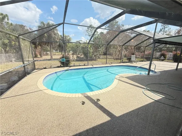 a view of a swimming pool with a patio