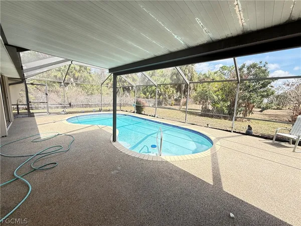 a view of a kitchen with a large window
