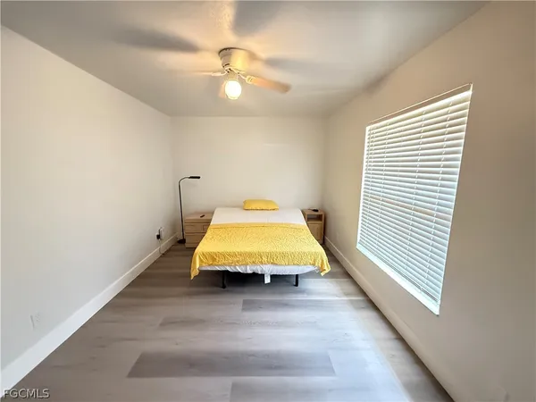 a room with pool table and a chandelier