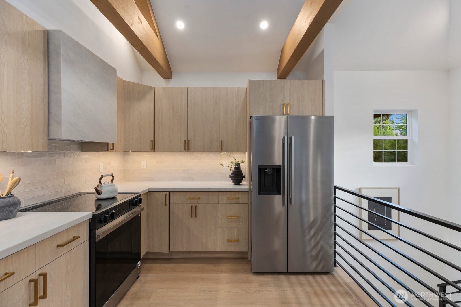8216 Interlake Avenue North Seattle, WA 98103 - Photo 11 of 36 a kitchen with stainless steel appliances a refrigerator sink and cabinets