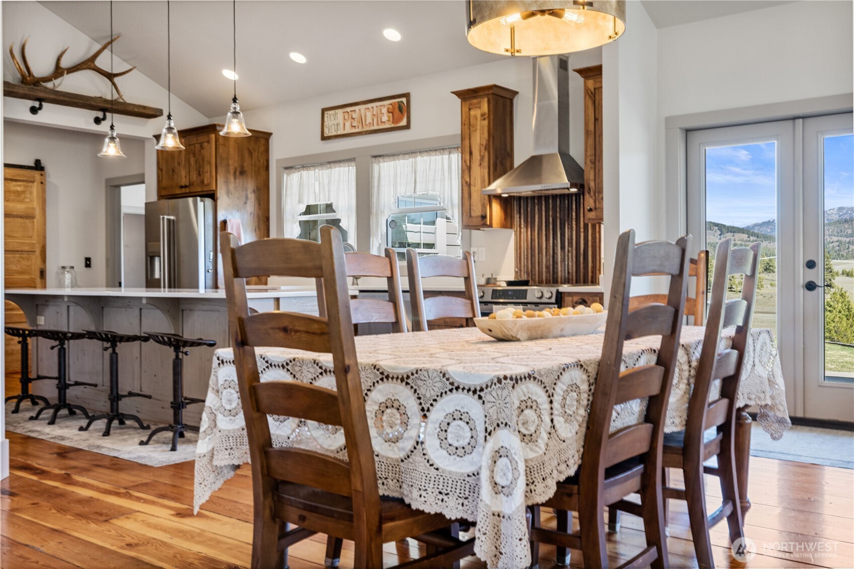 710 Hidden Valley Road Cle Elum, WA 98922 - Photo 11 of 35 a view of a dining room with furniture and wooden floor