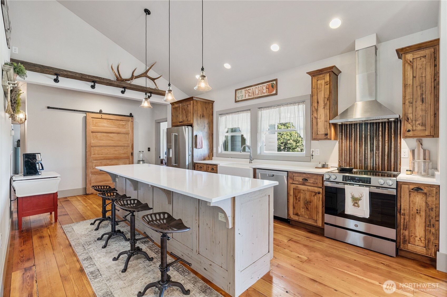 710 Hidden Valley Road Cle Elum, WA 98922 - Photo 12 of 35 a kitchen with stainless steel appliances a stove a sink a refrigerator and chairs