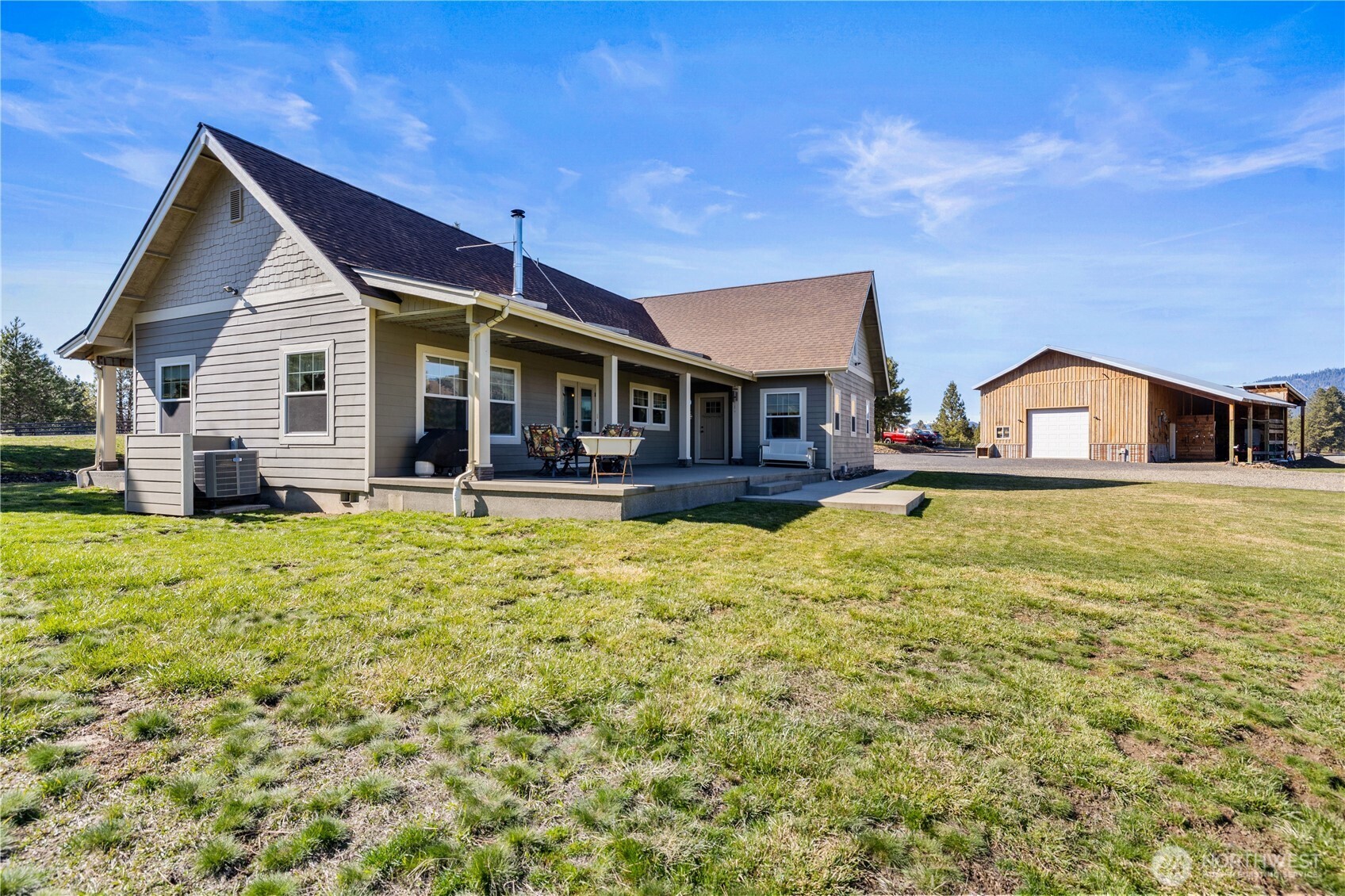 710 Hidden Valley Road Cle Elum, WA 98922 - Photo 2 of 35 a front view of house with yard outdoor seating and barbeque oven