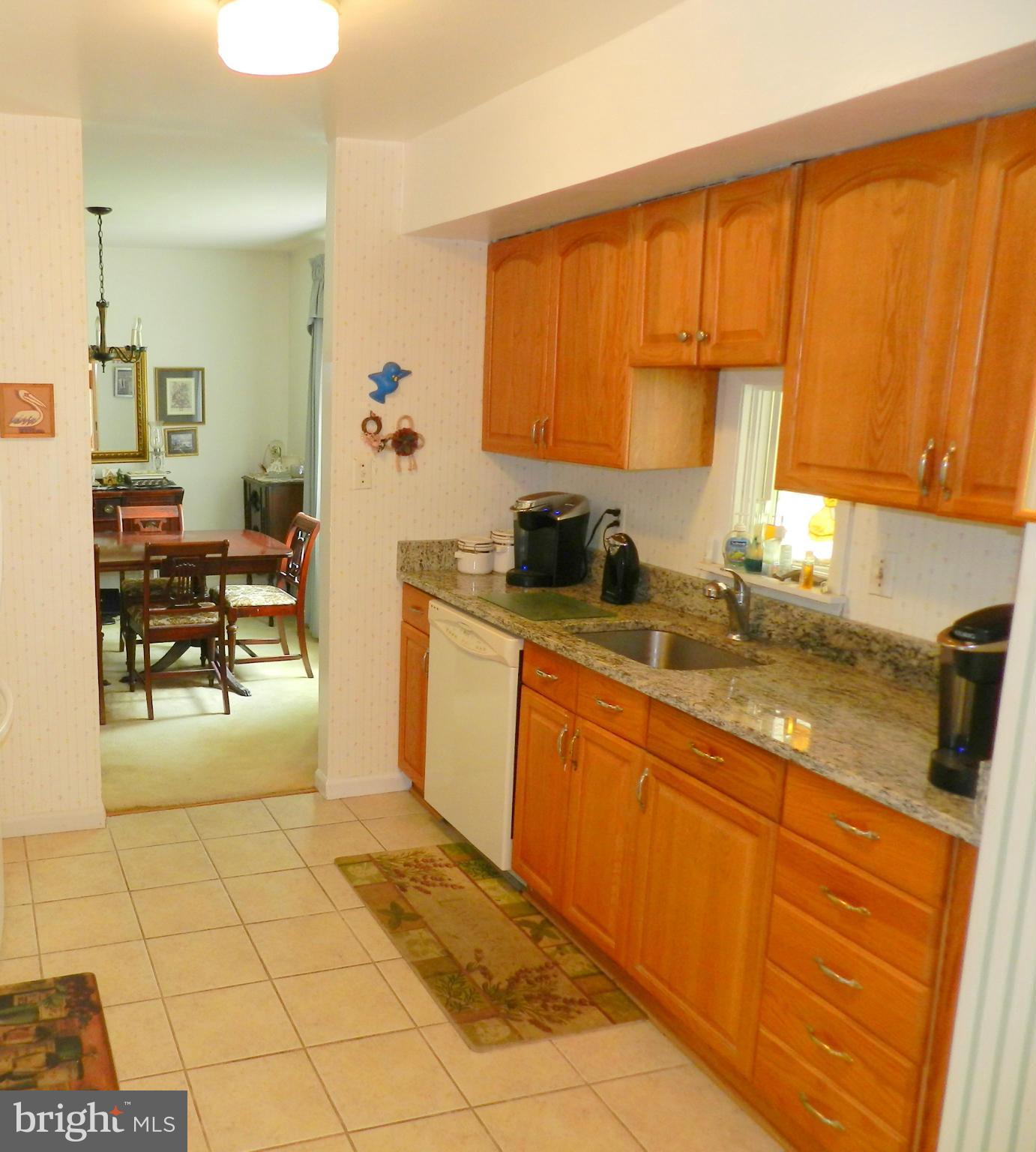 17408 Chiswell Road Poolesville, MD 20837 - Photo 14 of 29 a kitchen with stainless steel appliances granite countertop a sink and cabinets