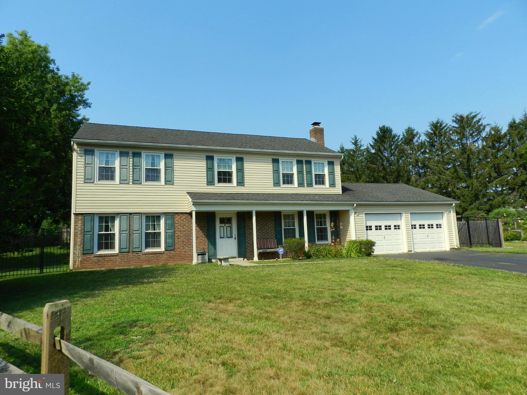 17408 Chiswell Road Poolesville, MD 20837 - Photo 3 of 29 a front view of a house with a yard