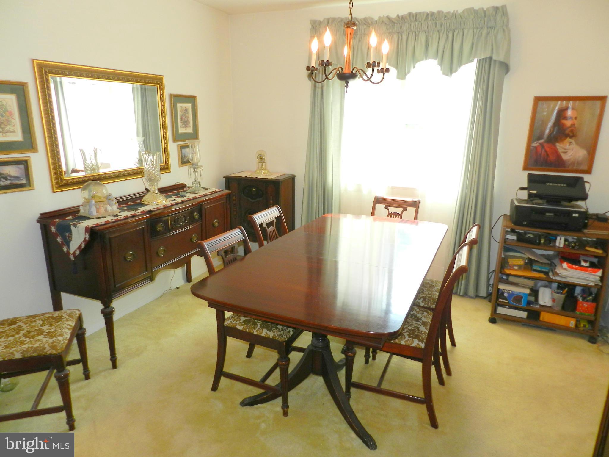 17408 Chiswell Road Poolesville, MD 20837 - Photo 22 of 29 a view of a dining room with furniture
