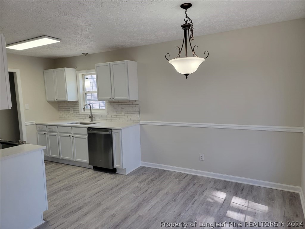 191 Rye Lane Raeford, NC 28376 - Photo 25 of 44 a kitchen with a refrigerator and cabinets