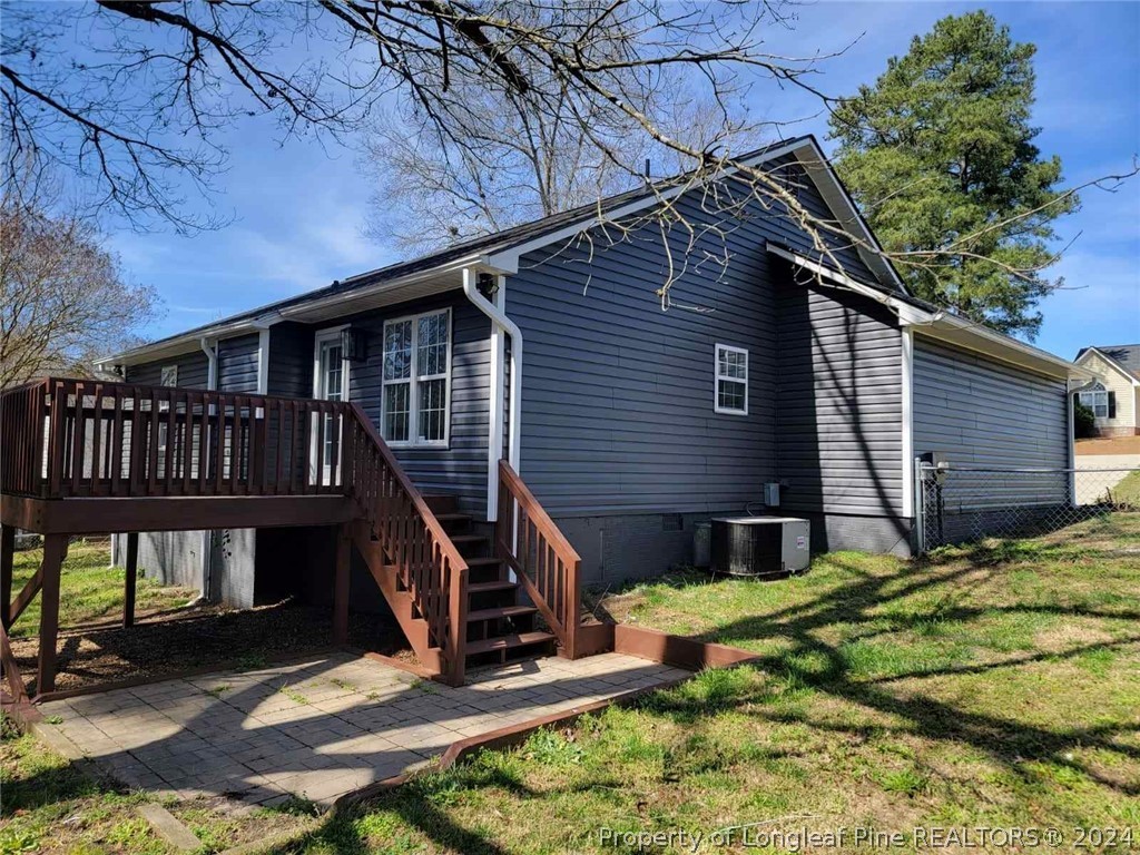 191 Rye Lane Raeford, NC 28376 - Photo 3 of 44 a view of a house with backyard and deck