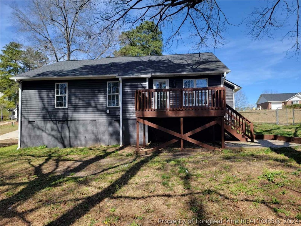 191 Rye Lane Raeford, NC 28376 - Photo 6 of 44 a view of a backyard with a small area and wooden fence