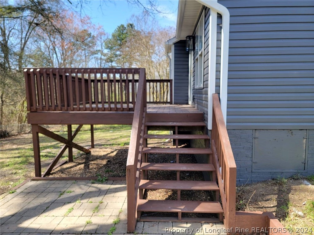 191 Rye Lane Raeford, NC 28376 - Photo 8 of 44 a view of balcony with wooden floor and fence