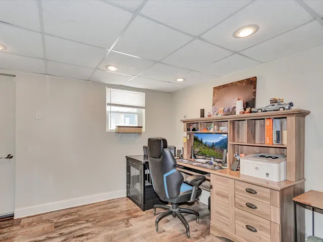 a workspace with furniture and window