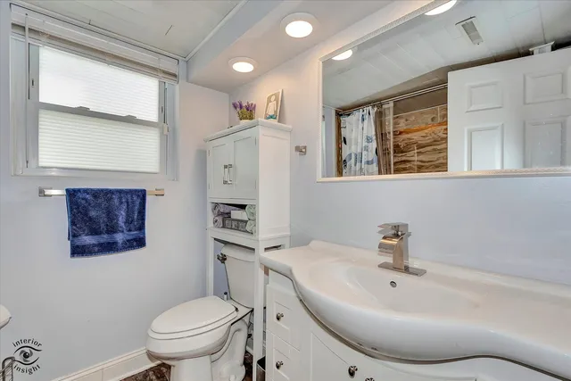 a bathroom with a sink toilet and a bathtub