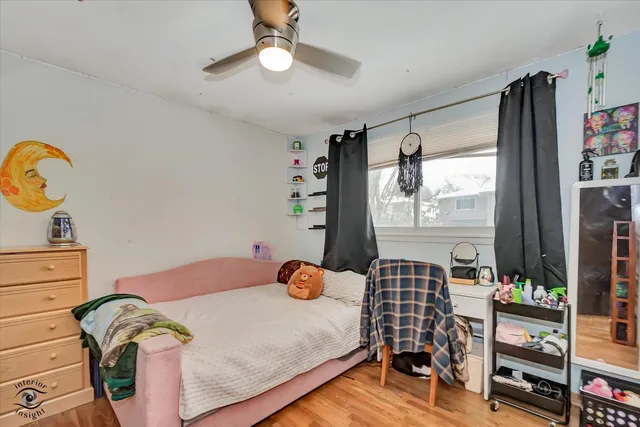 a bedroom with furniture and a window