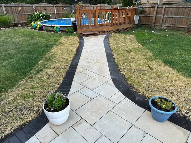 a view of a backyard with sitting area