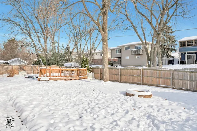 a view of a building with snow on the road