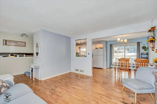 a bedroom with furniture and wooden floor