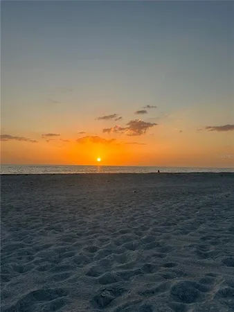 a view of a garden with an ocean view