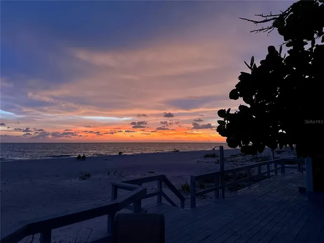 a view of an ocean and a mountain
