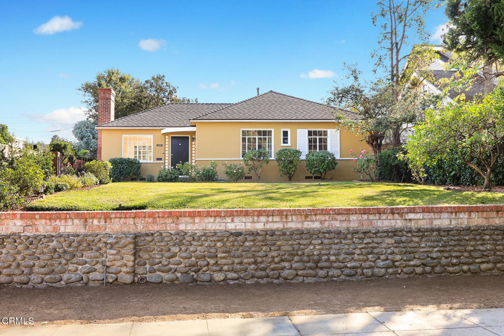 a view of house with a swimming pool