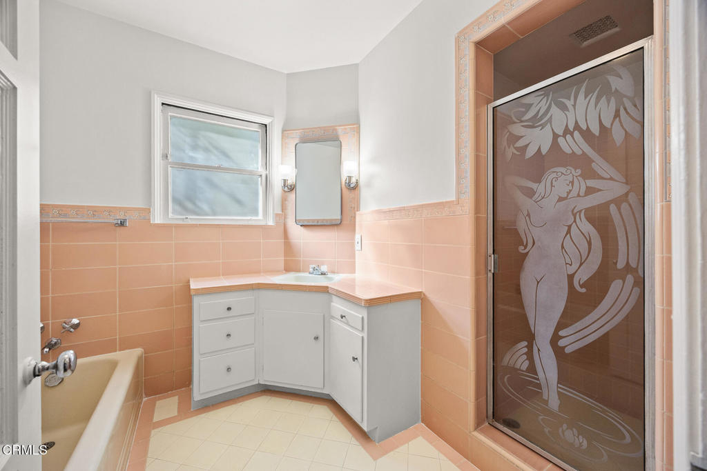 1519 Spruce Street South Pasadena, CA 91030 - Photo 4 of 5 a bathroom with a sink a mirror and a shower