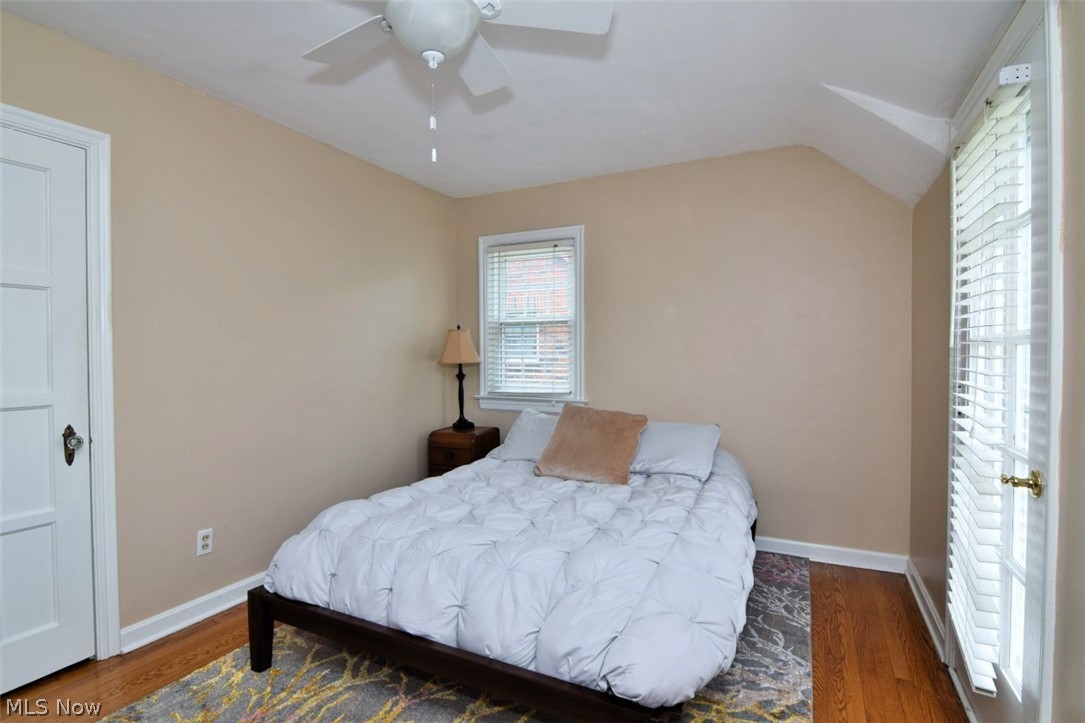 3451 Edison Road Cleveland Heights, OH 44121 - Photo 29 of 46 Hardwood flooring, painted walls, white door, window with blinds, and a ceiling fan