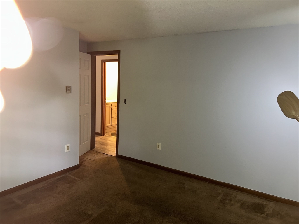 10 Pearl Street Ware, MA 01082 - Photo 5 of 12 an empty room with a window