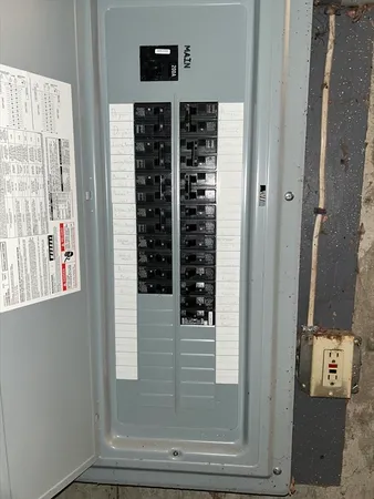 a balcony with wooden floor and city view