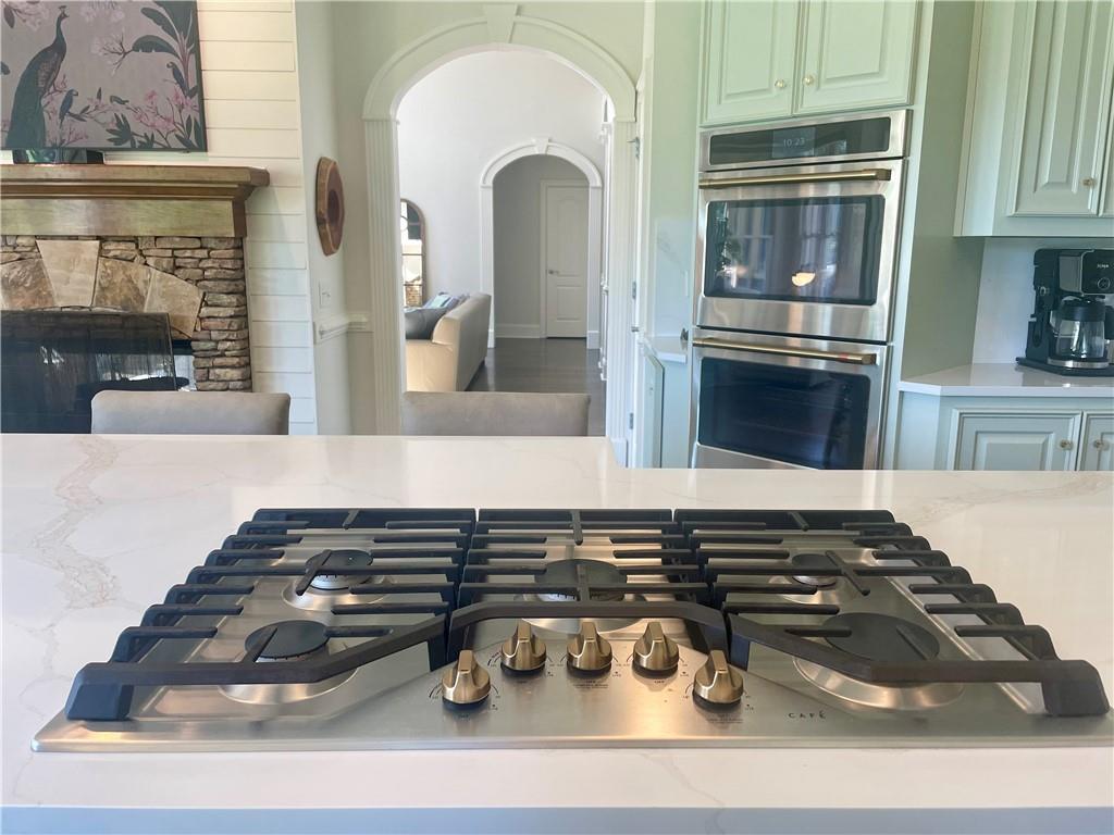 960 Providence Lane Monroe, GA 30656 - Photo 14 of 53 a kitchen with a stove and a microwave