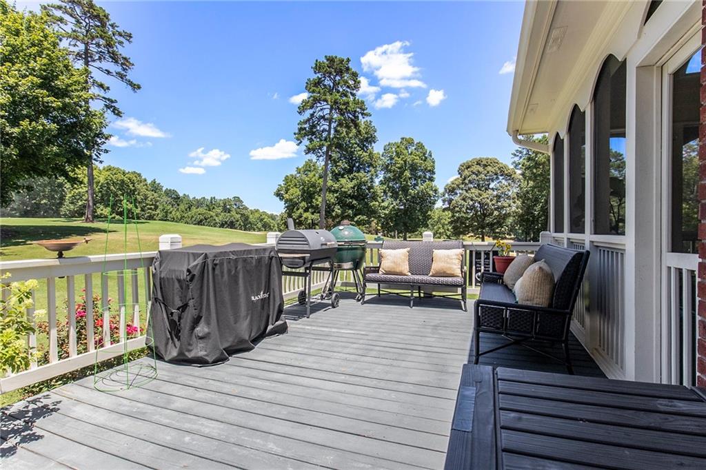 960 Providence Lane Monroe, GA 30656 - Photo 20 of 53 a view of a deck with chairs and wooden floor