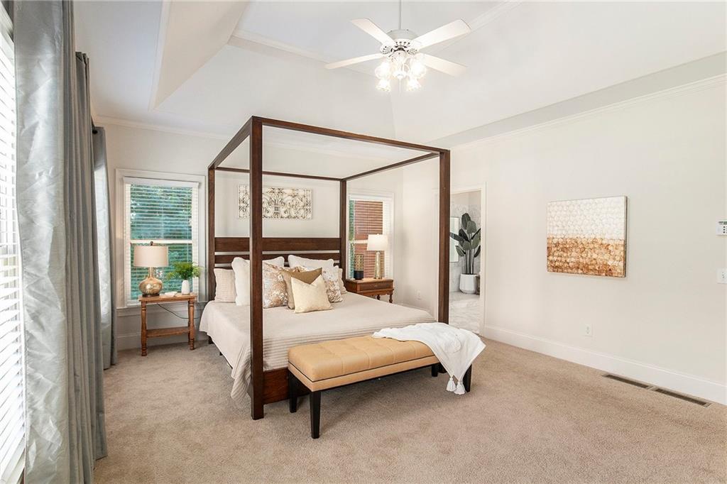 960 Providence Lane Monroe, GA 30656 - Photo 23 of 53 a bedroom with a bed and a large window