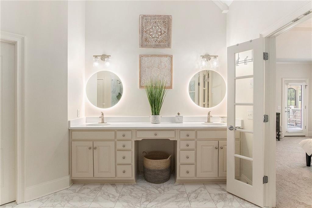 960 Providence Lane Monroe, GA 30656 - Photo 26 of 53 a bathroom with a double vanity sink and a mirror